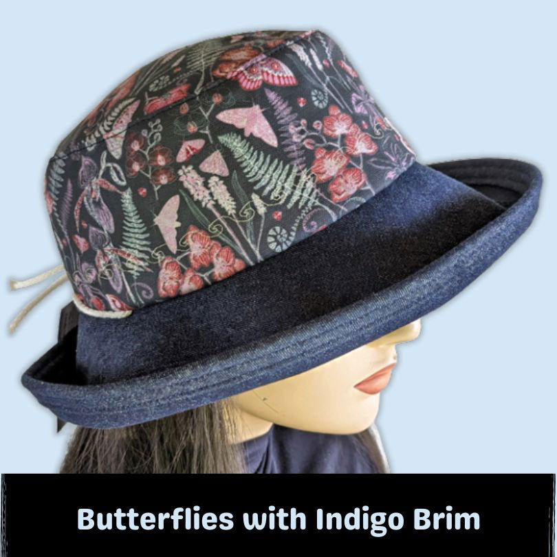 107-cc Sunblocker UV summer sun hat featuring denim brim, navy garden floral and butterflies