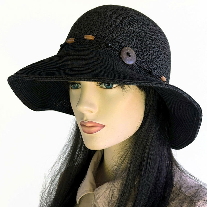 Packable black straw hat with button trim and lovely crochet textures, wired brim edge, adjustable fit