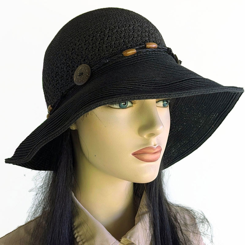 Packable black straw hat with button trim and lovely crochet textures, wired brim edge, adjustable fit