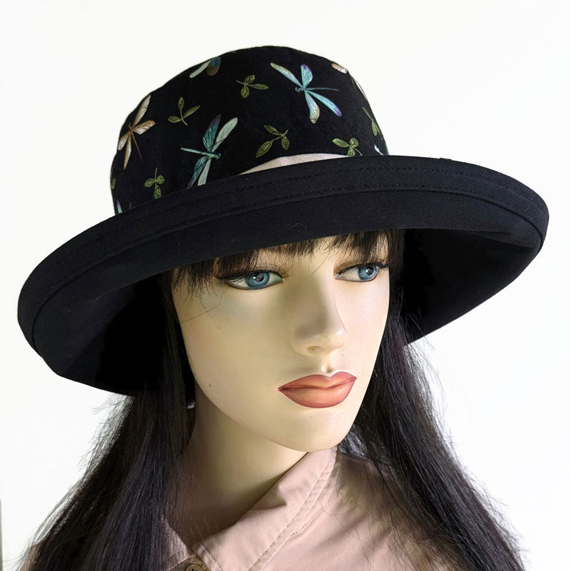 Sunblocker with lovely dragonfly print with black base, adjustable fit, wide brim