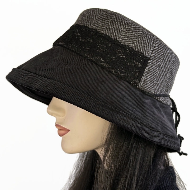 Cord Fashion hat with in black and grey, herringbone print, with large bucket brim and adjustable fit