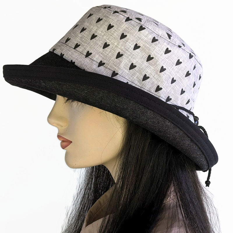 102-h Sunblocker with adjustable fit, black hearts on grey with black denim brim