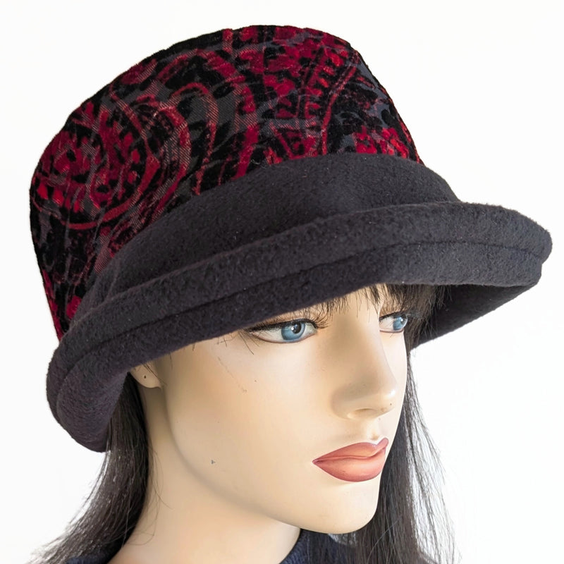 Niagara Fashion Bucket Hat with earflaps,  in black fleece with red and  black abstract band and flattering brim