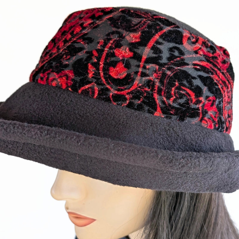 Niagara Fashion Bucket Hat with earflaps,  in black fleece with red and  black abstract band and flattering brim