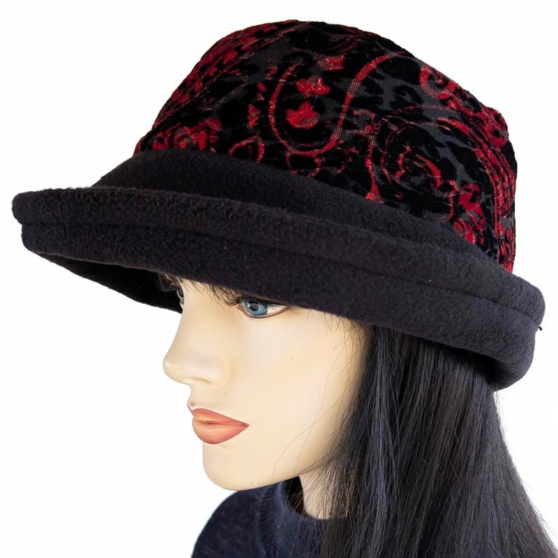 Niagara Fashion Bucket Hat with earflaps,  in black fleece with red and  black abstract band and flattering brim