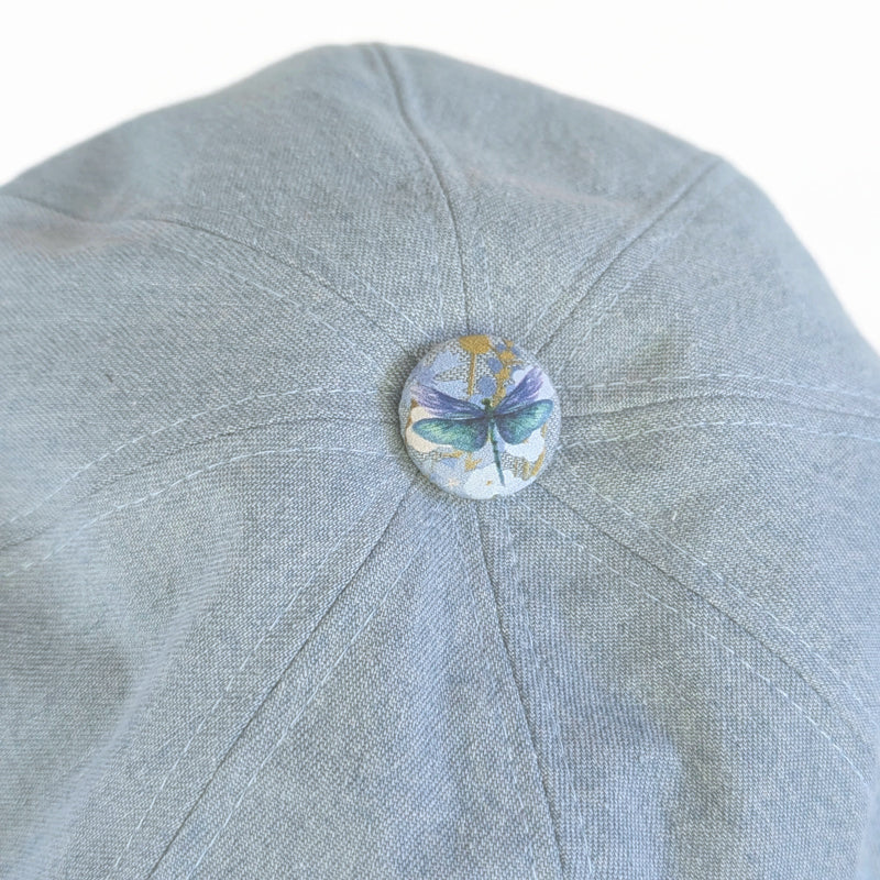Baggy Poorboy Fashion Cap in bleached denim, embossed vinyl visor, dragonfly trim
