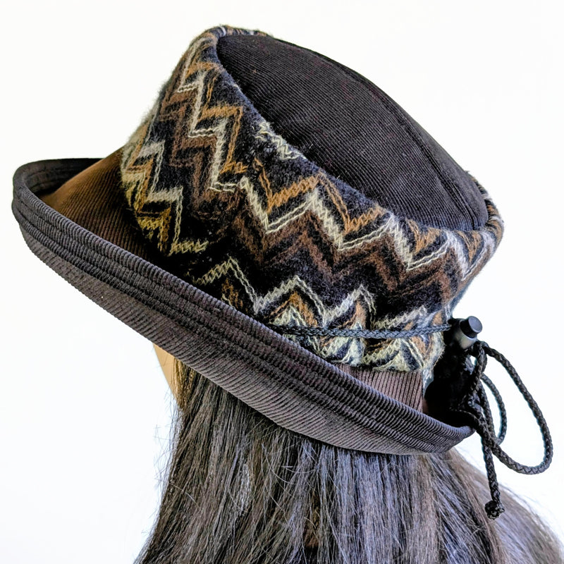 Cord Fashion hat with in black and browns, woolen zig zag band, with large bucket brim and adjustable fit
