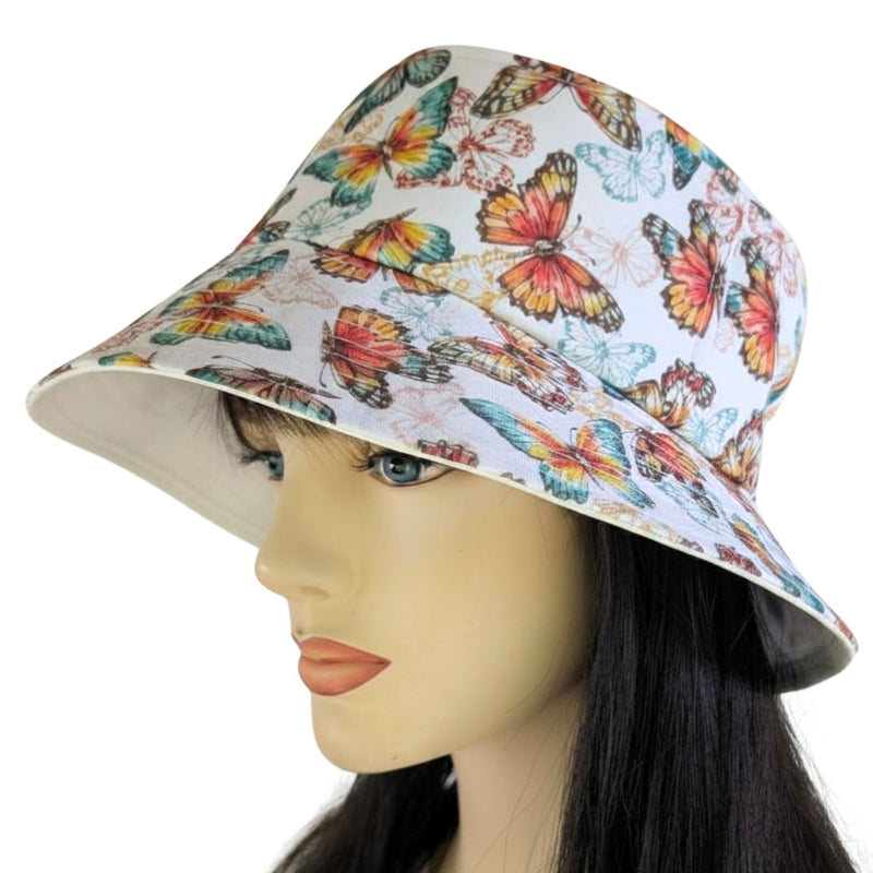 Sun Hat Perfect Bucket Hat, orange based butterfly print, deep bucket brim