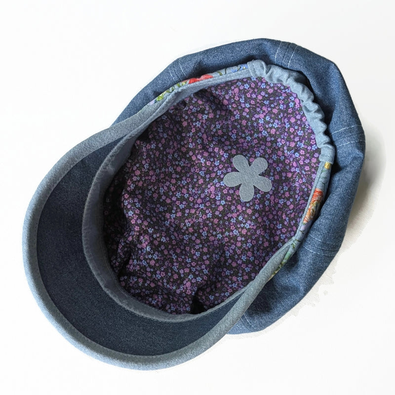 Poorboy Fashion Cap in washed blue denim, floral with dragonflies accents, flattering visor, baggy fit