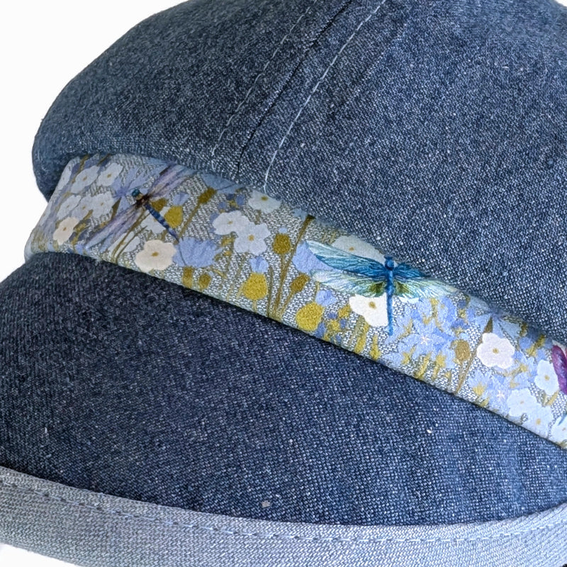 Poorboy Fashion Cap in washed blue denim, floral with dragonflies in pastels, flattering visor, baggy fit