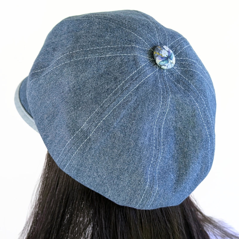 Poorboy Fashion Cap in washed blue denim, floral with dragonflies in pastels, flattering visor, baggy fit