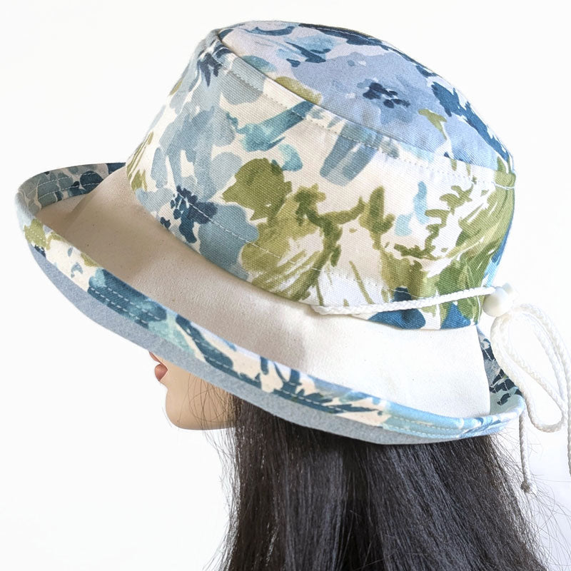 Sunblocker UV summer sun hat with wide brim, canvas floral in blues, adjustable fit