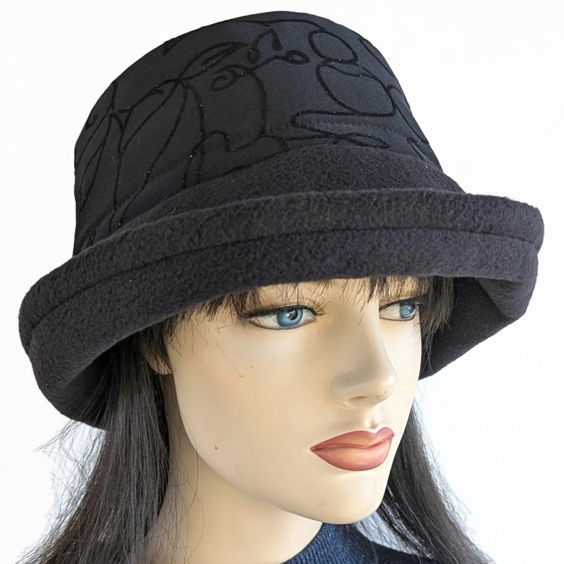 Niagara Fashion Bucket Hat with earflaps,  in black fleece with sparkly black abstract band and flattering brim