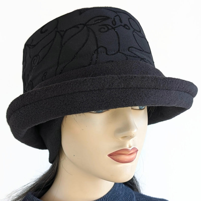 Niagara Fashion Bucket Hat with earflaps,  in black fleece with sparkly black abstract band and flattering brim