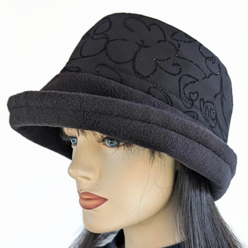 Niagara Fashion Bucket Hat with earflaps,  in black fleece with sparkly black abstract band and flattering brim