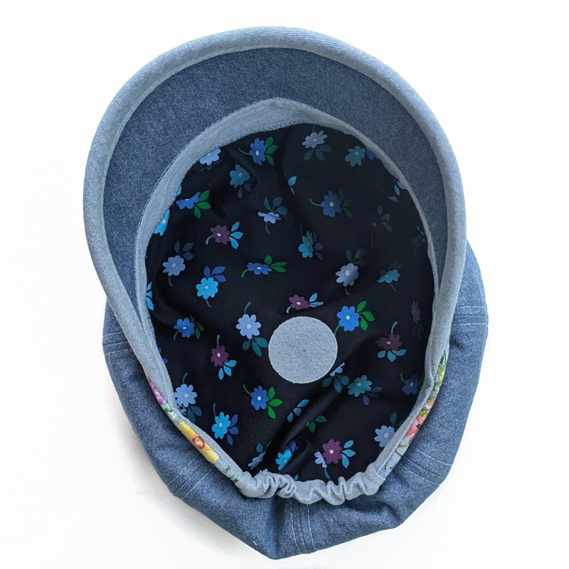Poorboy Fashion Cap in washed blue denim, floral with hummingbird accents, flattering visor, baggy fit