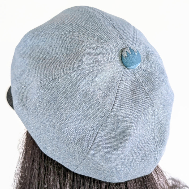 Poorboy Fashion Cap in bleached blue denim, loons on a lake theme, flattering visor, baggy fit