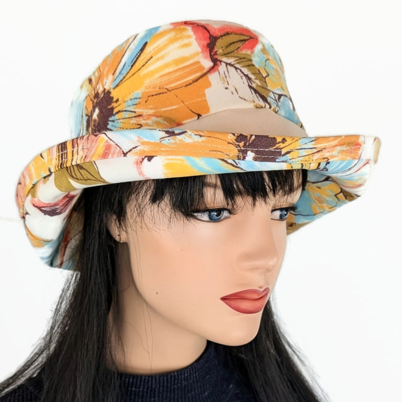 Weatherblocker rain/sun  fun hat built to resist sun, rain and stains, orange and earth tone floral