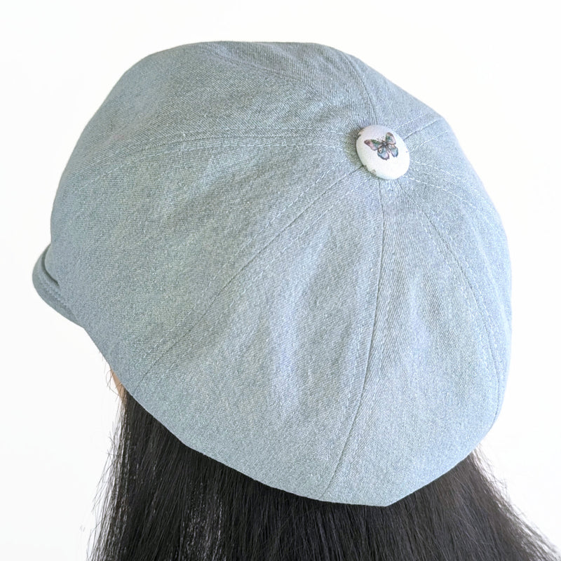 Poorboy Fashion Cap in bleached blue denim, pale butterfly dragonfly accents, flattering visor, baggy fit