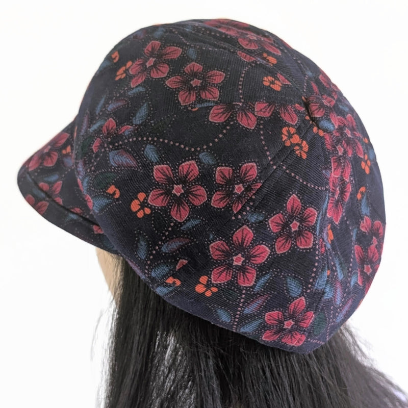Baggy Poorboy Fashion Cap in  cord, plum based floral, with wide flattering visor, one size fit