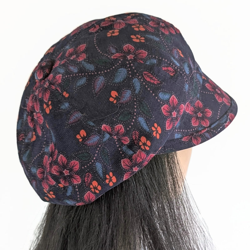 Baggy Poorboy Fashion Cap in  cord, plum based floral, with wide flattering visor, one size fit