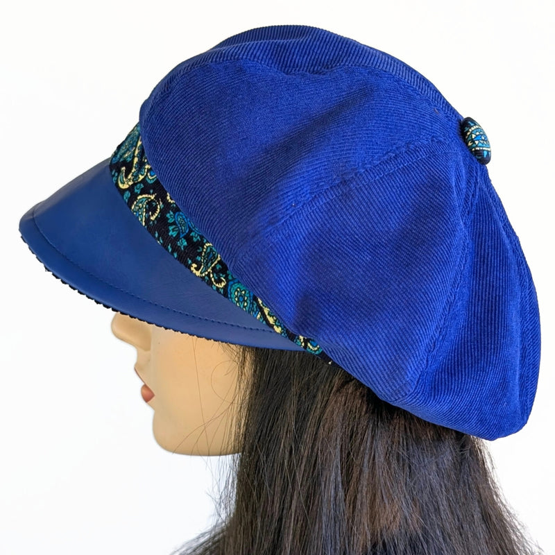 Poorboy Fashion Cap in royal blue corduroy with royal faux leather visor and paisley print trim