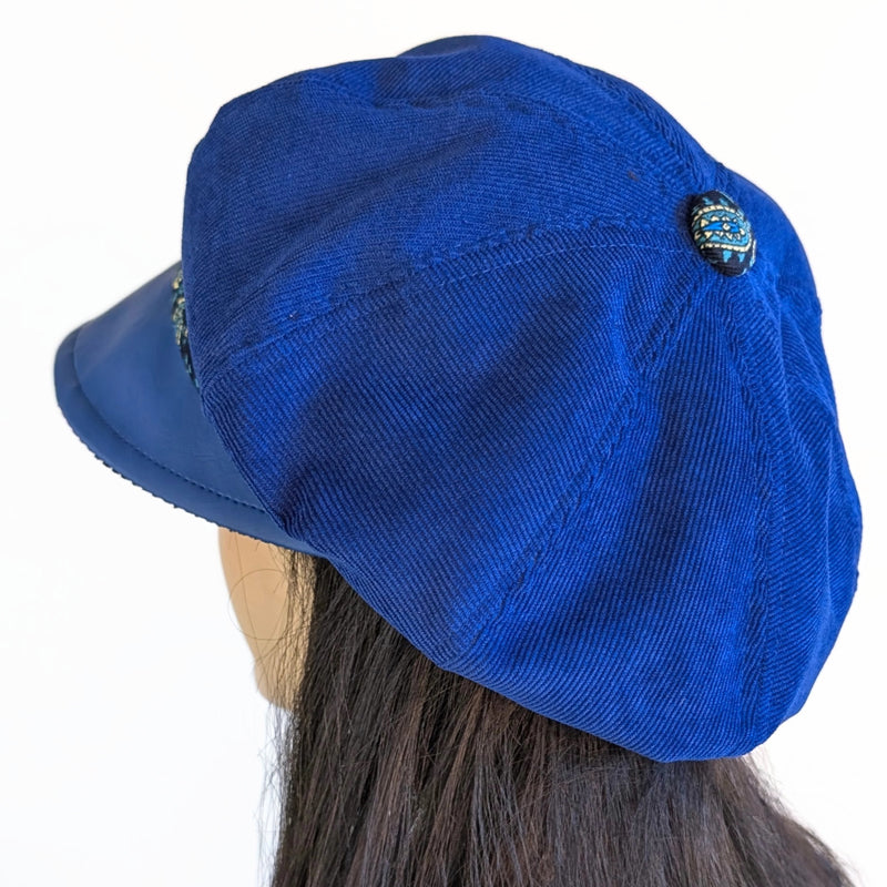 Poorboy Fashion Cap in royal blue corduroy with royal faux leather visor and paisley print trim