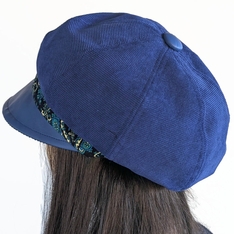 Poorboy Fashion Cap in royal blue corduroy with royal faux leather visor and paisley print trim