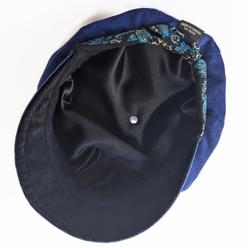 Poorboy Fashion Cap in royal blue corduroy with royal faux leather visor and paisley print trim