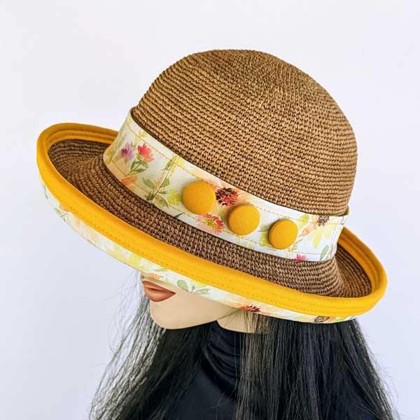 Raffia Straw sun hat with sunflowers under brim, orange accents, adjustable fit, button band  trim