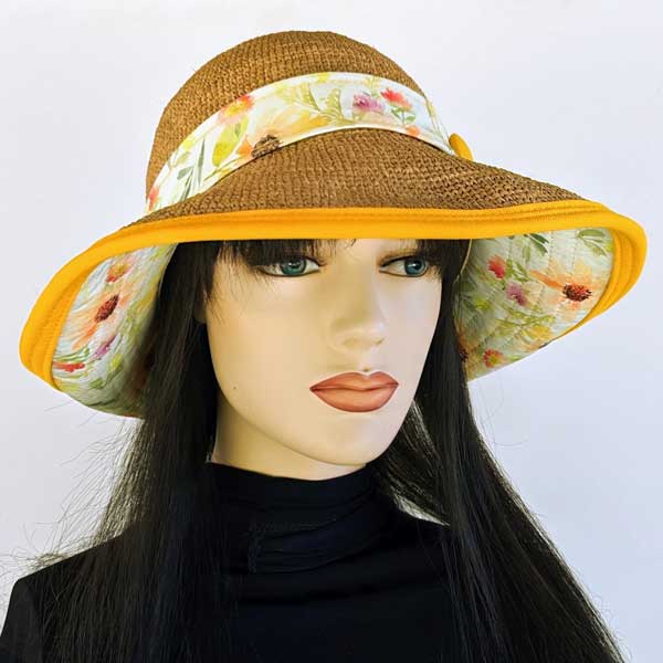 Raffia Straw sun hat with sunflowers under brim, orange accents, adjustable fit, button band  trim