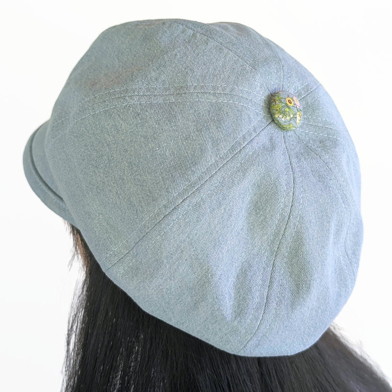 Poorboy Fashion Cap in bleached blue denim, yellow sunflower butterfly accents, flattering visor, baggy fit