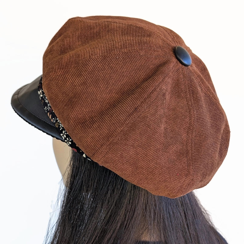 Poorboy Fashion Cap in toffee corduroy with black faux leather visor and floral print