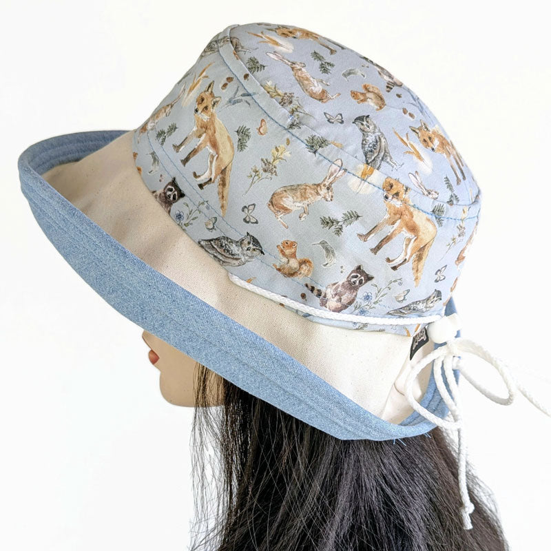 Sunblocker UV summer sun hat with large wide brim, featuring wildlife print, adjustable fit