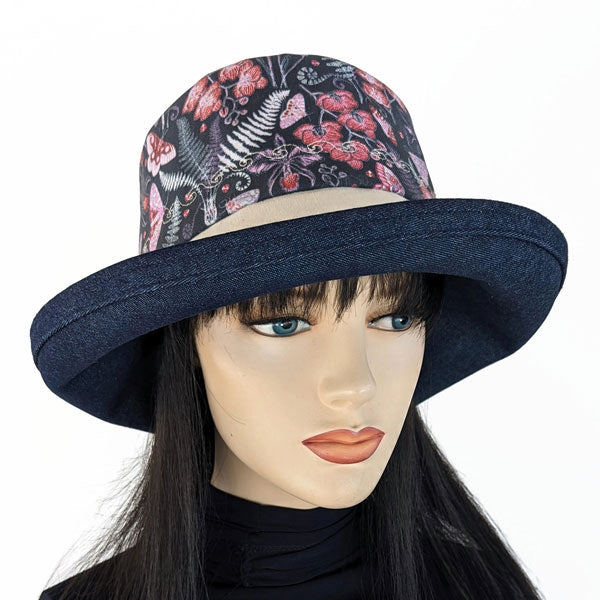 107-c Sunblocker UV summer sun hat featuring navy garden floral and butterflies