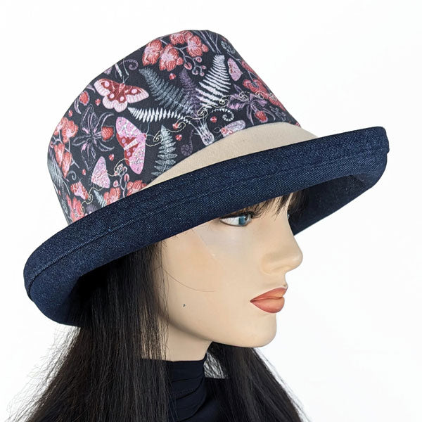 107-c Sunblocker UV summer sun hat featuring navy garden floral and butterflies