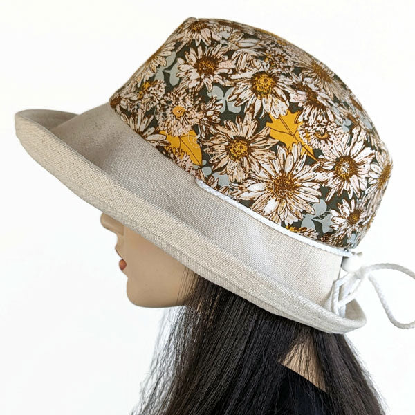 115-a Sunblocker UV summer hat with large wide brim featuring sunflowers print in earth tones