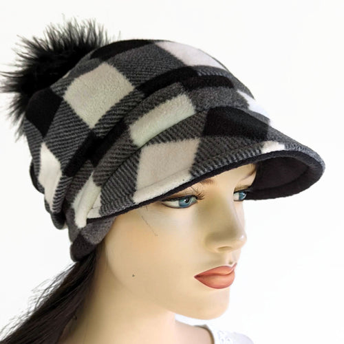 Fashion Pom Pom Cap in fleece with flattering visor and slouchy fit, assorted plaids