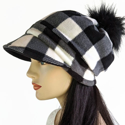 Fashion Pom Pom Cap in fleece with flattering visor and slouchy fit, assorted plaids