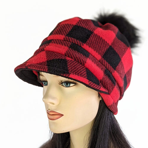 Fashion Pom Pom Cap in fleece with flattering visor and slouchy fit, assorted plaids