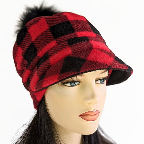 Fashion Pom Pom Cap in fleece with flattering visor and slouchy fit, assorted plaids