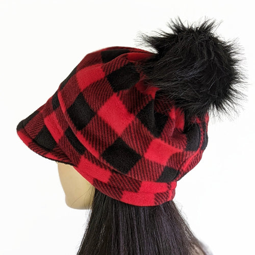 Fashion Pom Pom Cap in fleece with flattering visor and slouchy fit, assorted plaids