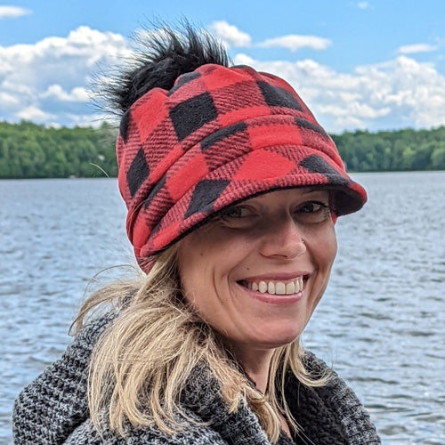 Fashion Pom Pom Cap in fleece with flattering visor and slouchy fit, assorted plaids