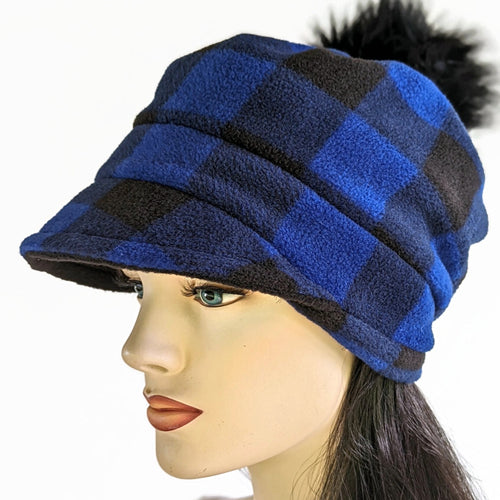 Fashion Pom Pom Cap in fleece with flattering visor and slouchy fit, assorted plaids