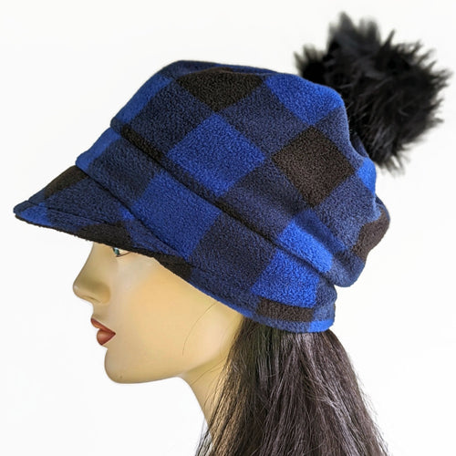 Fashion Pom Pom Cap in fleece with flattering visor and slouchy fit, assorted plaids