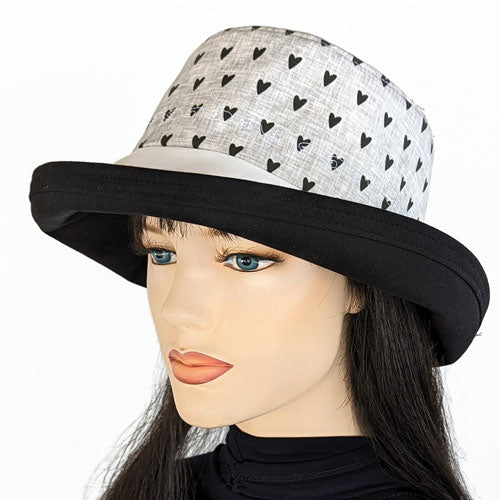 102-a Sunblocker wide brim sun hat with black hearts on white and grey