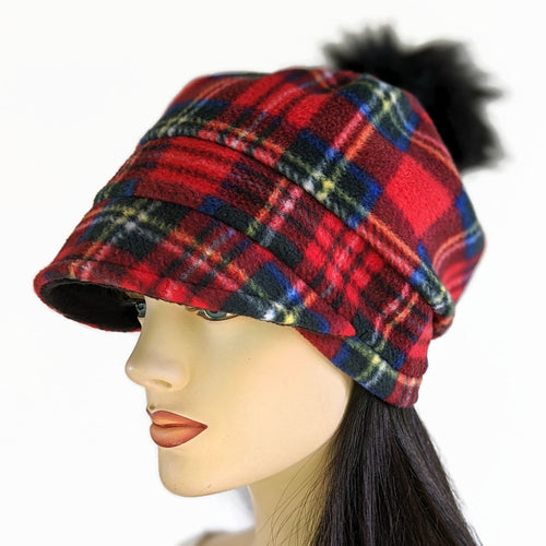 Fashion Pom Pom Cap in fleece with flattering visor and slouchy fit, assorted plaids